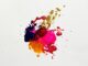 Colorful abstract paint splash on white background, capturing creative expression.