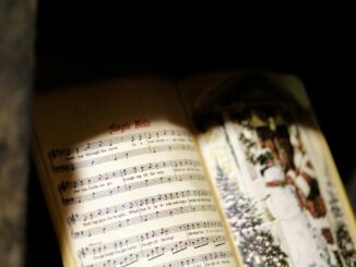 Close-up of a Jingle Bells music sheet with festive imagery, perfect for Christmas themes.