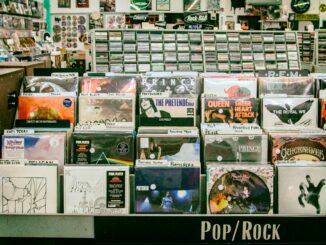 Explore a diverse collection of vinyl records in a vibrant San Mateo music store.