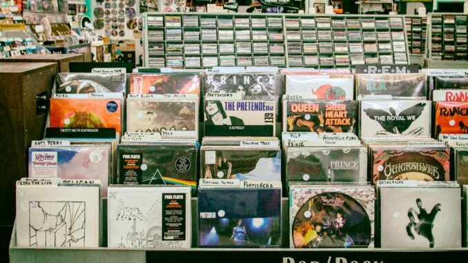 Explore a diverse collection of vinyl records in a vibrant San Mateo music store.