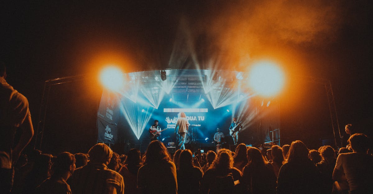 Energetic live music performance at night with a lively crowd.