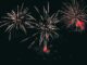 Vibrant fireworks illuminating the night sky with colorful bursts.