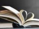 Open book with pages forming a heart, symbolizing love for reading and literature.