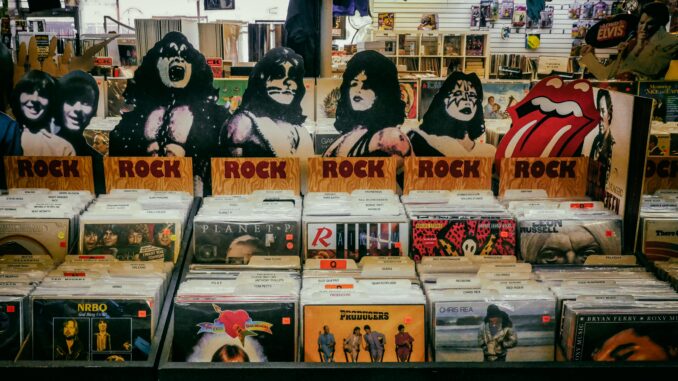 Explore a classic rock section in a vintage vinyl records shop, showcasing iconic albums and memorabilia.