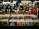 Explore a classic rock section in a vintage vinyl records shop, showcasing iconic albums and memorabilia.