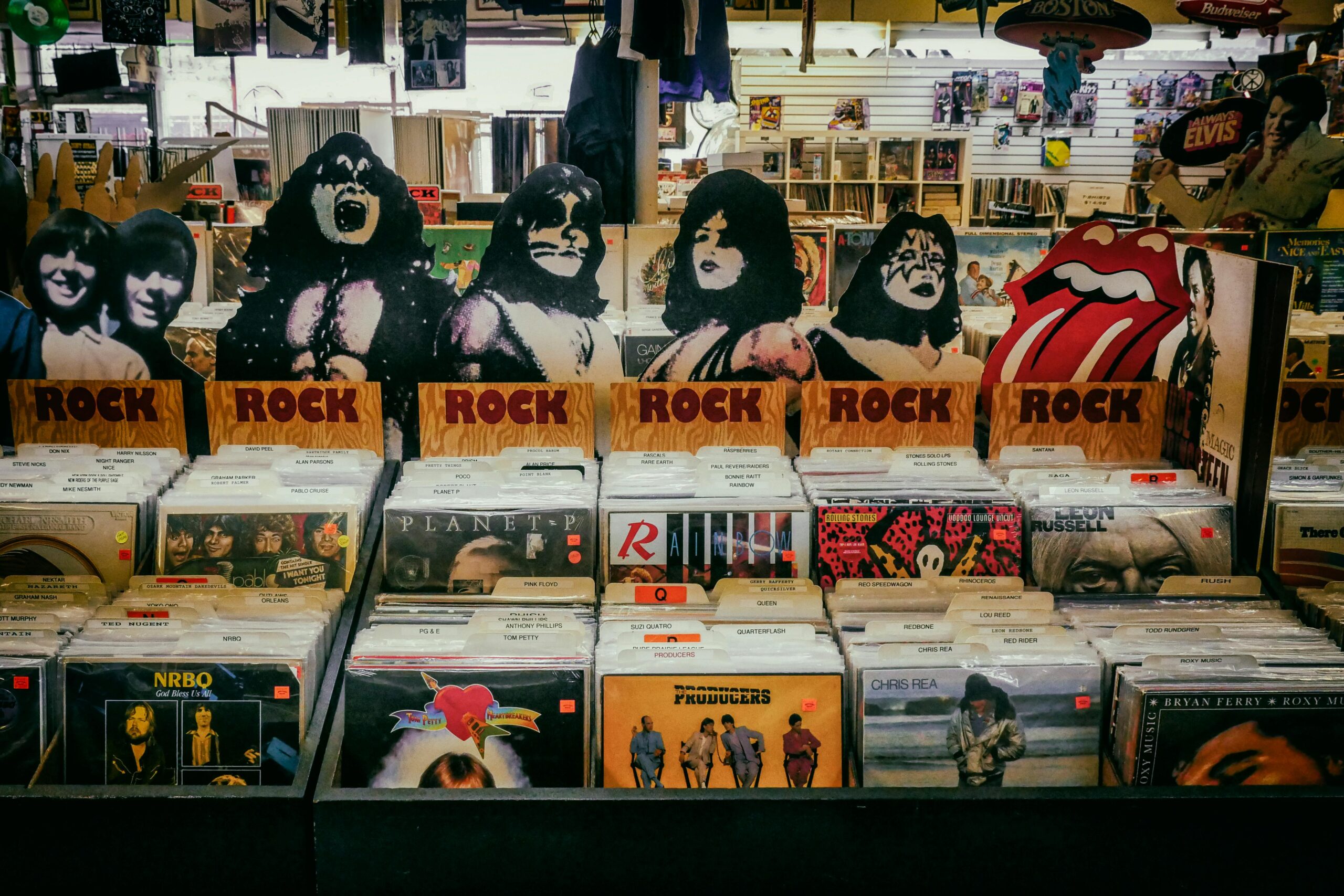 Explore a classic rock section in a vintage vinyl records shop, showcasing iconic albums and memorabilia.
