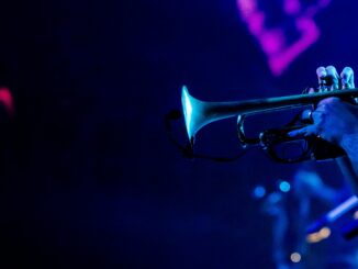 Vibrant image of a trumpeter playing during a live jazz concert, capturing the essence of musical performance.