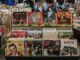 Retro vinyl collection featuring The Beatles and Elvis Presley in a classic music shop.