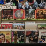Retro vinyl collection featuring The Beatles and Elvis Presley in a classic music shop.